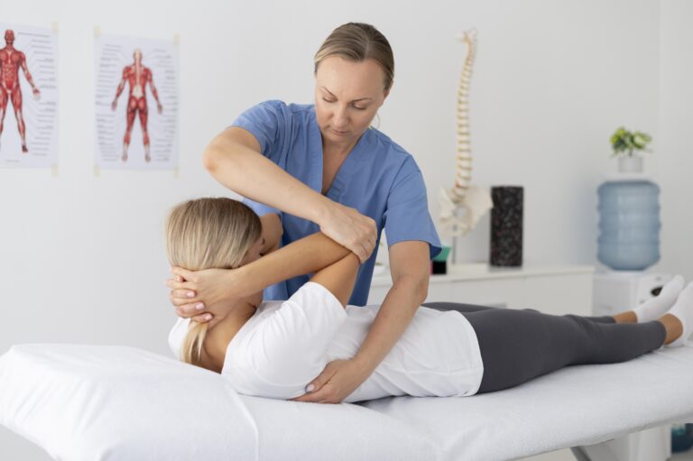 physiotherapist-helping-young-female-patient