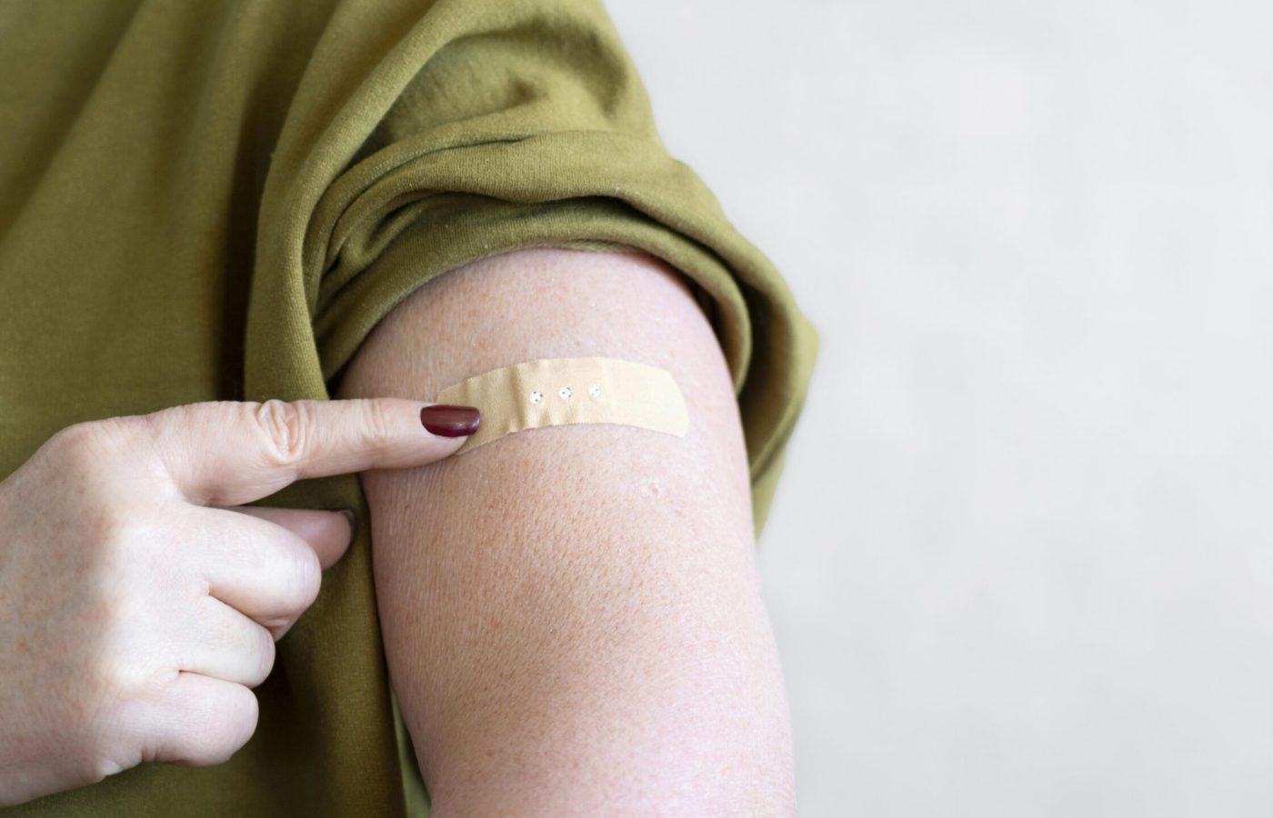 woman-with-bandage-arm-after-vaccination